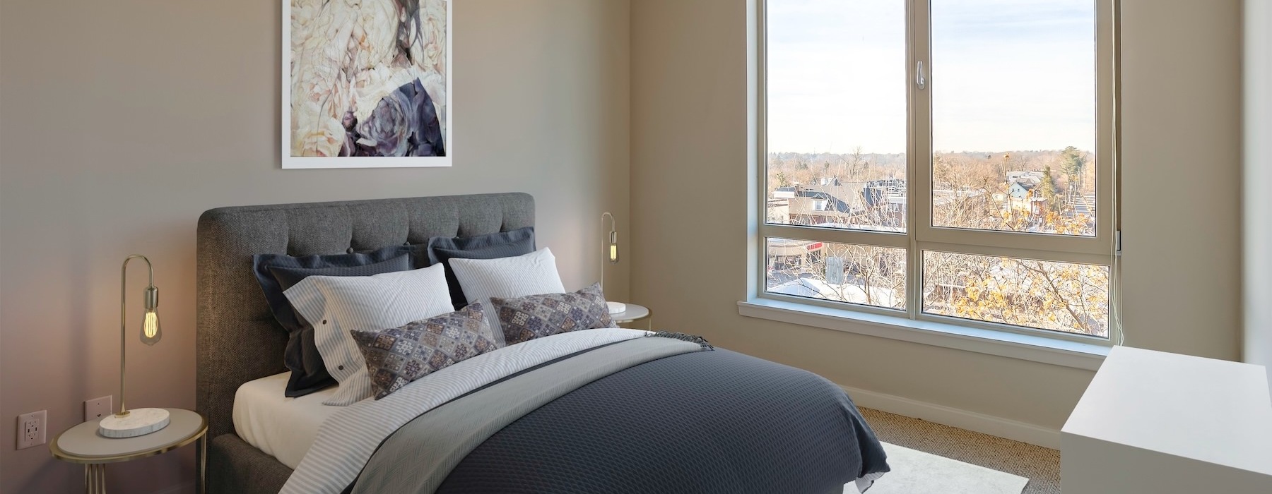 a bedroom with a bed and two nightstands