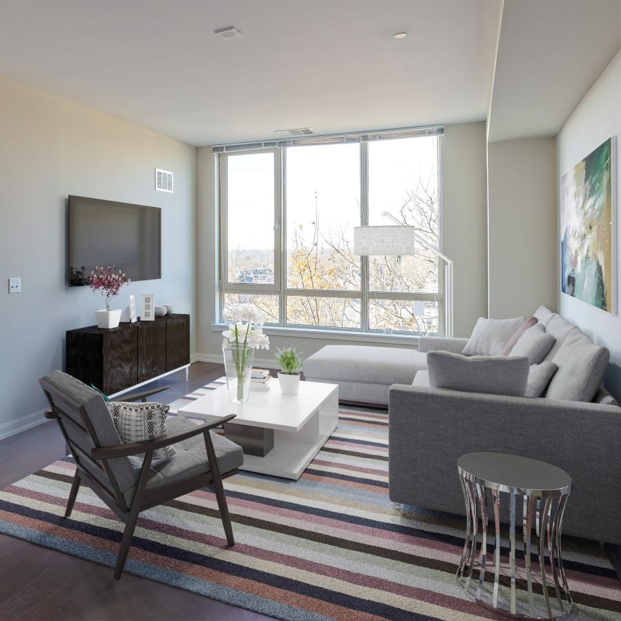 a living room with a chair and a couch