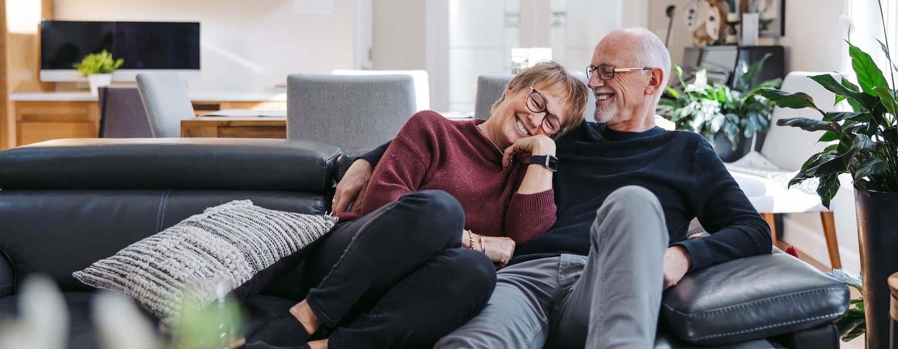 a man and woman sitting on a couch